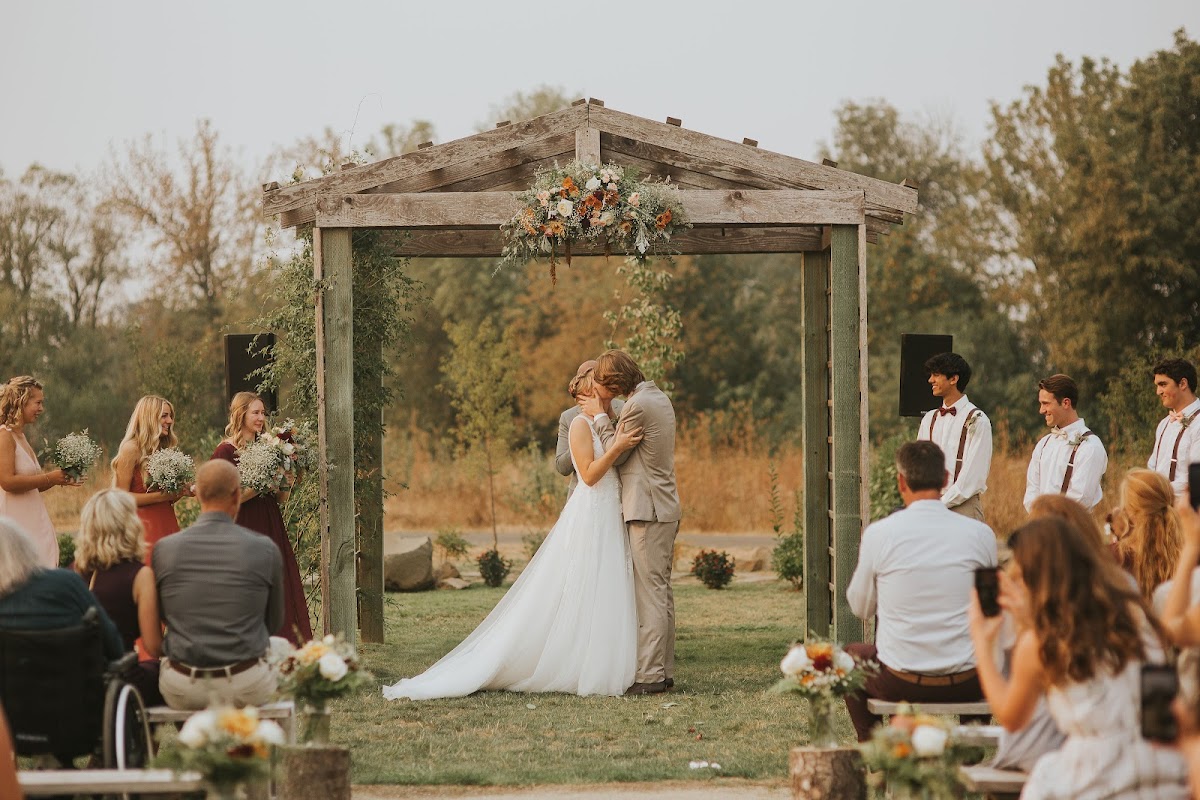 A first kiss under the arbor at Creekside Farm — Harrisburg, Oregon